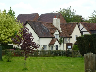 Houses on the edge of the churchyard in Bovingdon. 