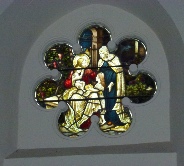 Stained glass window in Lilley St Peter